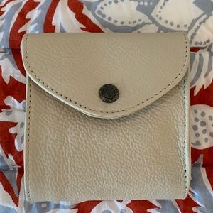 Never used 100% leather wallet. Size is great for belt bags, cross body.